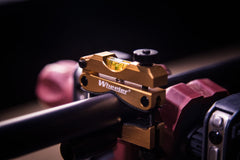 Adjustable barrel clamp level accommodating large-diameter barrels.