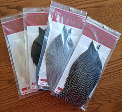 Whiting Farms Hen Cape in Grizzly dyed Coachman Brown for upright dry fly wings.