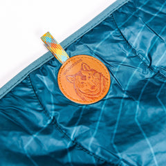 Wilderdog blanket folded with carrying strap for easy transport.