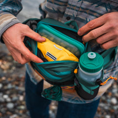 Wilderdog Mega Hip Pack dual bottle pockets keep hydration within reach during workouts.