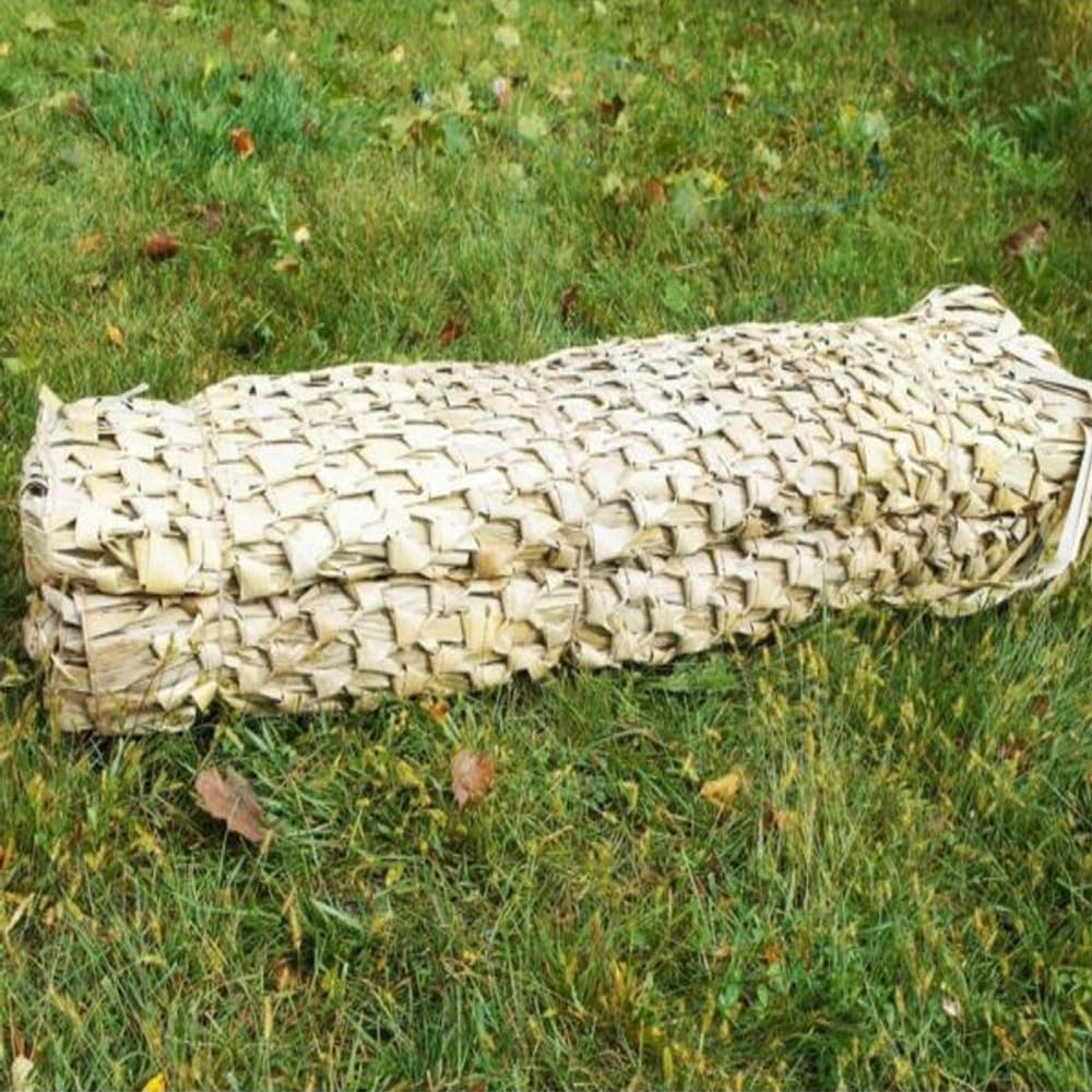 Wildfowler Grass Mats Wildgrass Camo layering on blind demonstrates versatile camouflage in marshy terrain