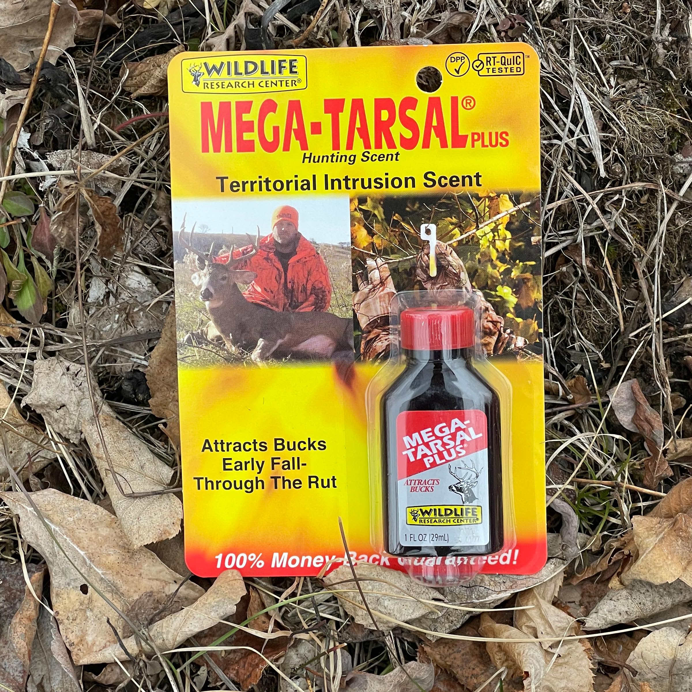 Amber glass bottle with Wildlife Research deer attractant label