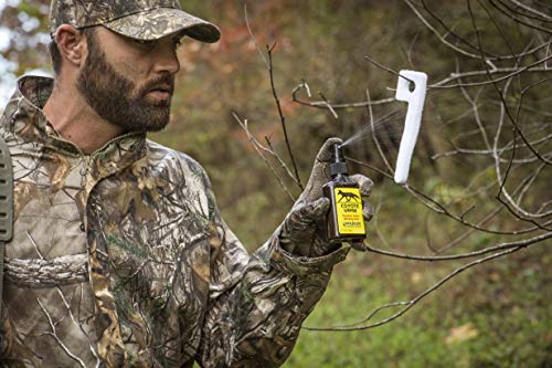 Wildlife Research Center hunting setup with bottle in field landscape