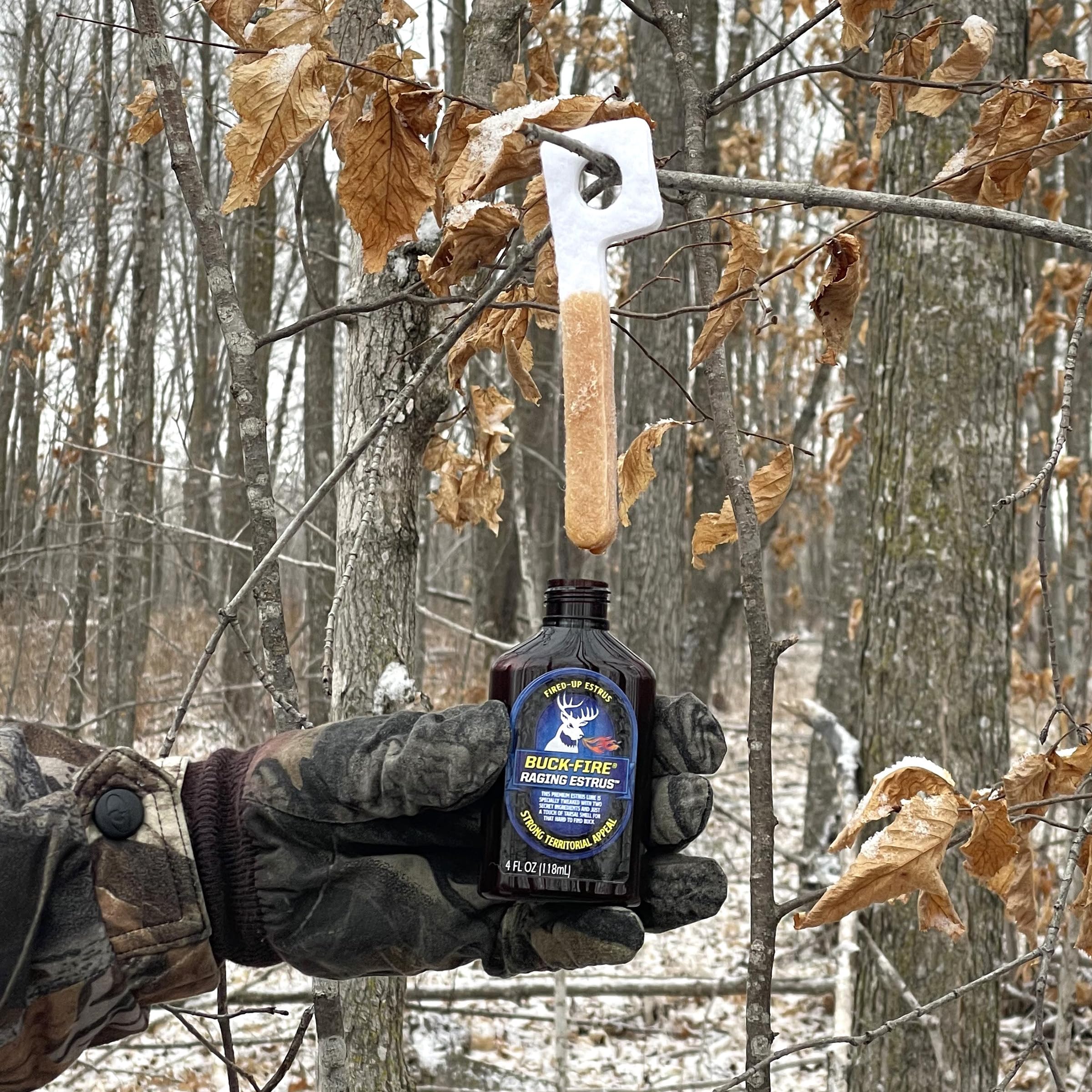 Wildlife Research Center Buck-Fire Raging Estrus label highlights premium scent and quality.