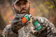Wildlife Research Center Daytime drip dispenser operates in rugged outdoor conditions.