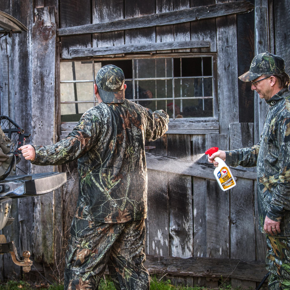 Wildlife Research Center dirt leaves forest scent scene highlighting autumn camouflage benefits.