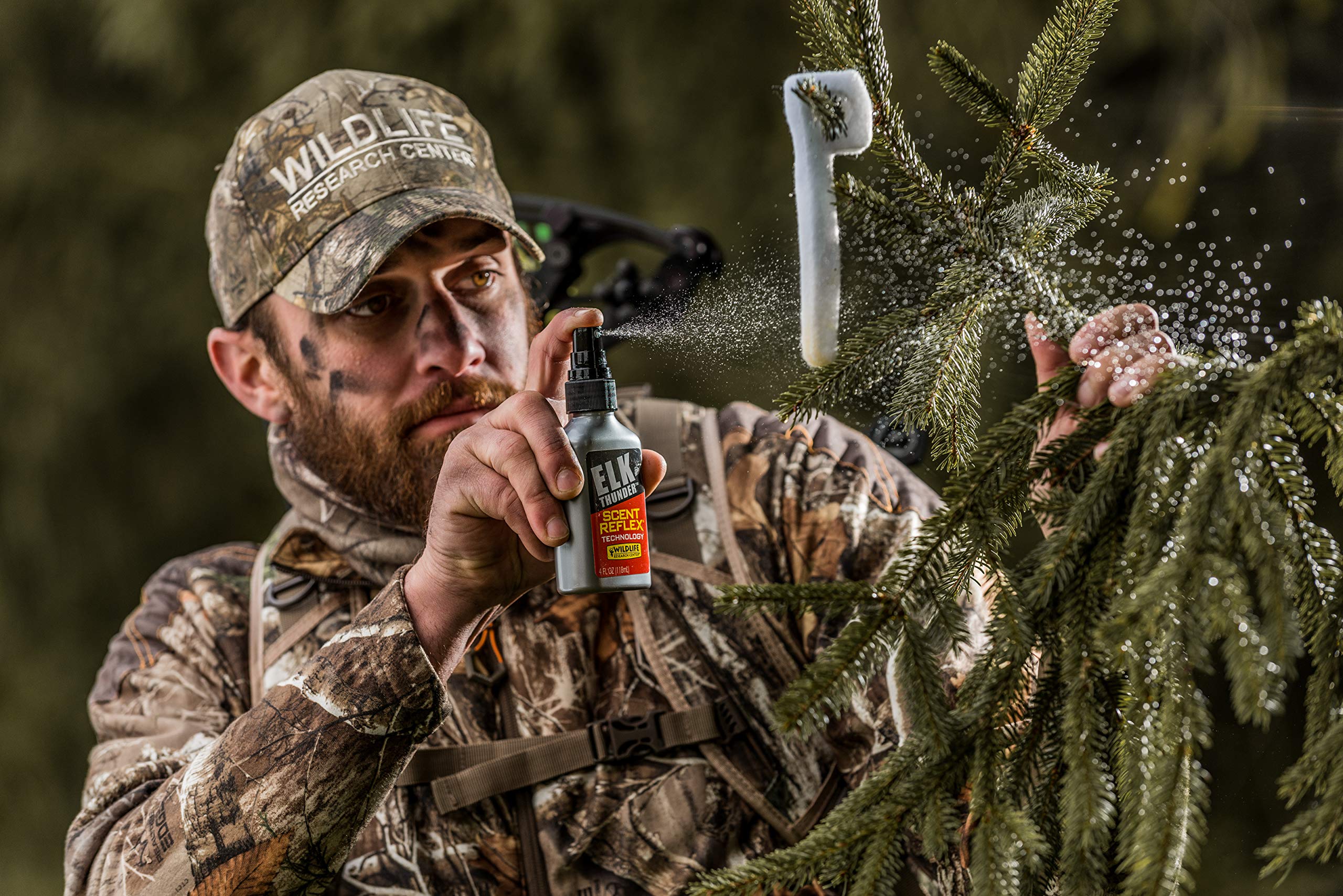 Scent Reflex Technology label visible on Elk Thunder bottle in use