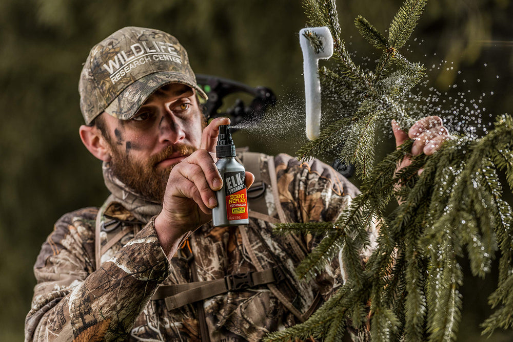 Scent Reflex Technology label visible on Elk Thunder bottle in use
