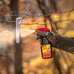 Wildlife Research Center estrus attractant spray bottle ready for field use.