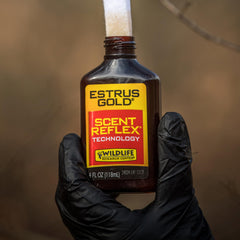 Close-up of Estrus Gold label highlighting ultra-realistic doe scent.