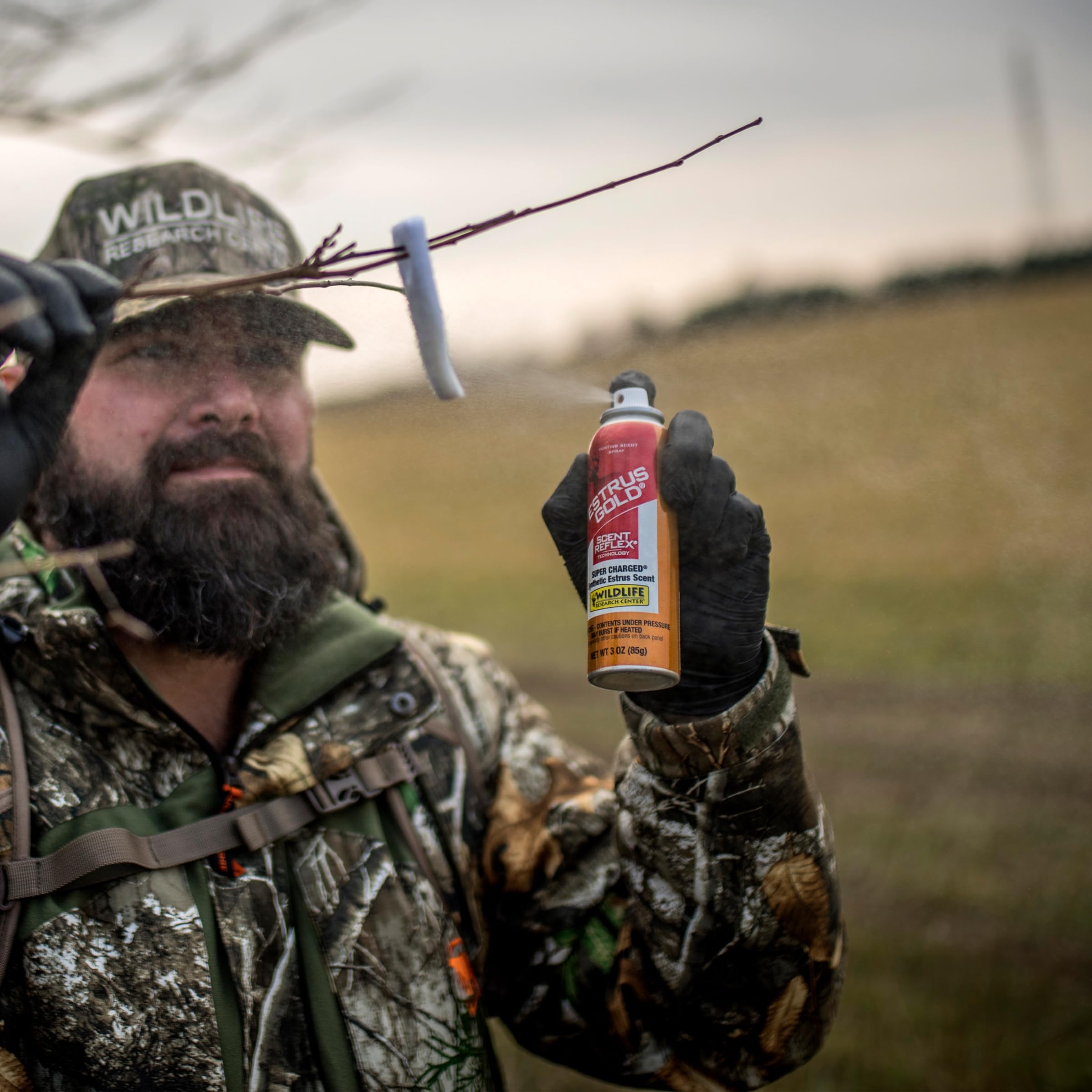 Wildlife Research Center Estrus Gold Spray scrape application for scent wicks and trails.