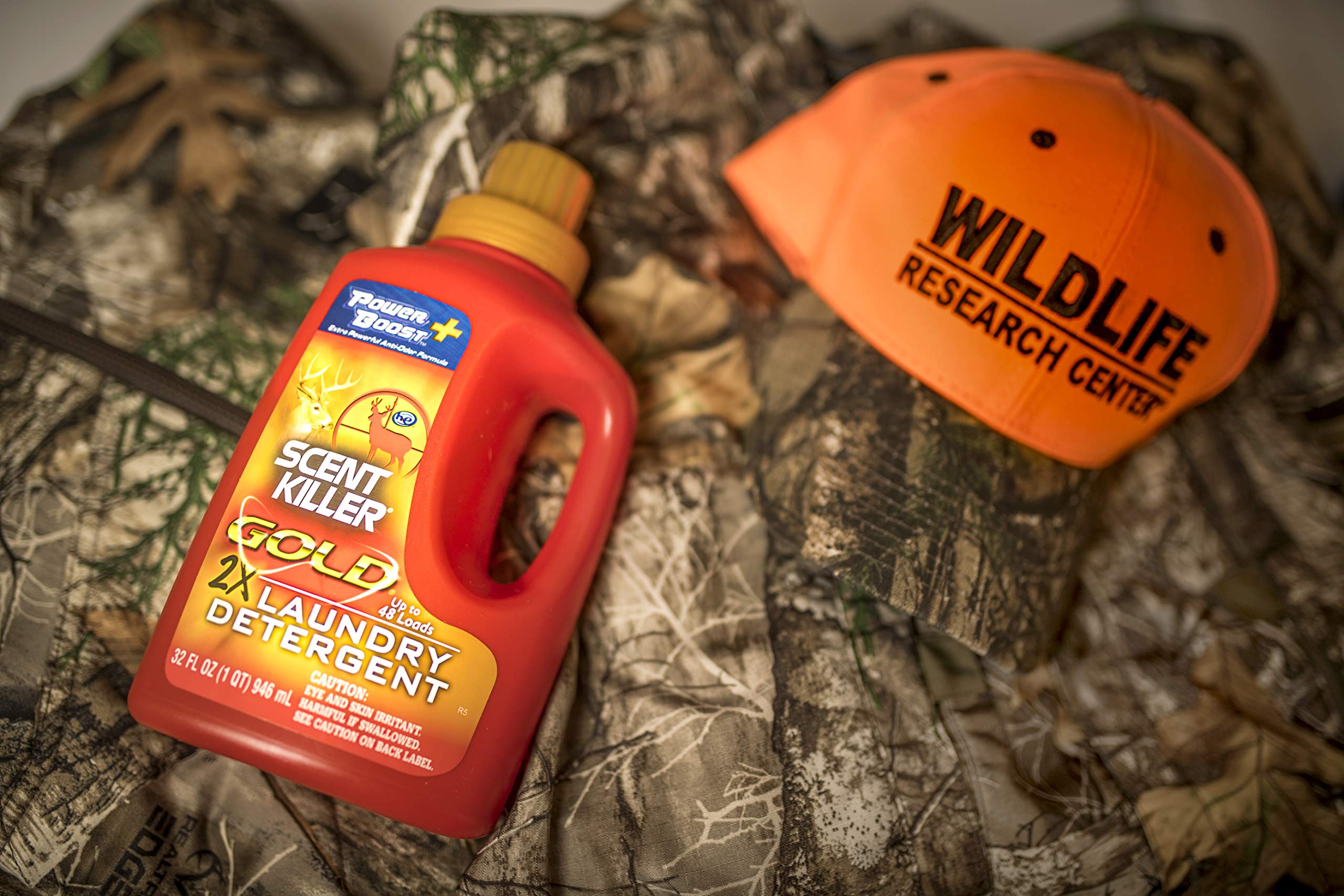 Scent Killer Gold HE formula bottle showing compatibility with standard and HE washers.