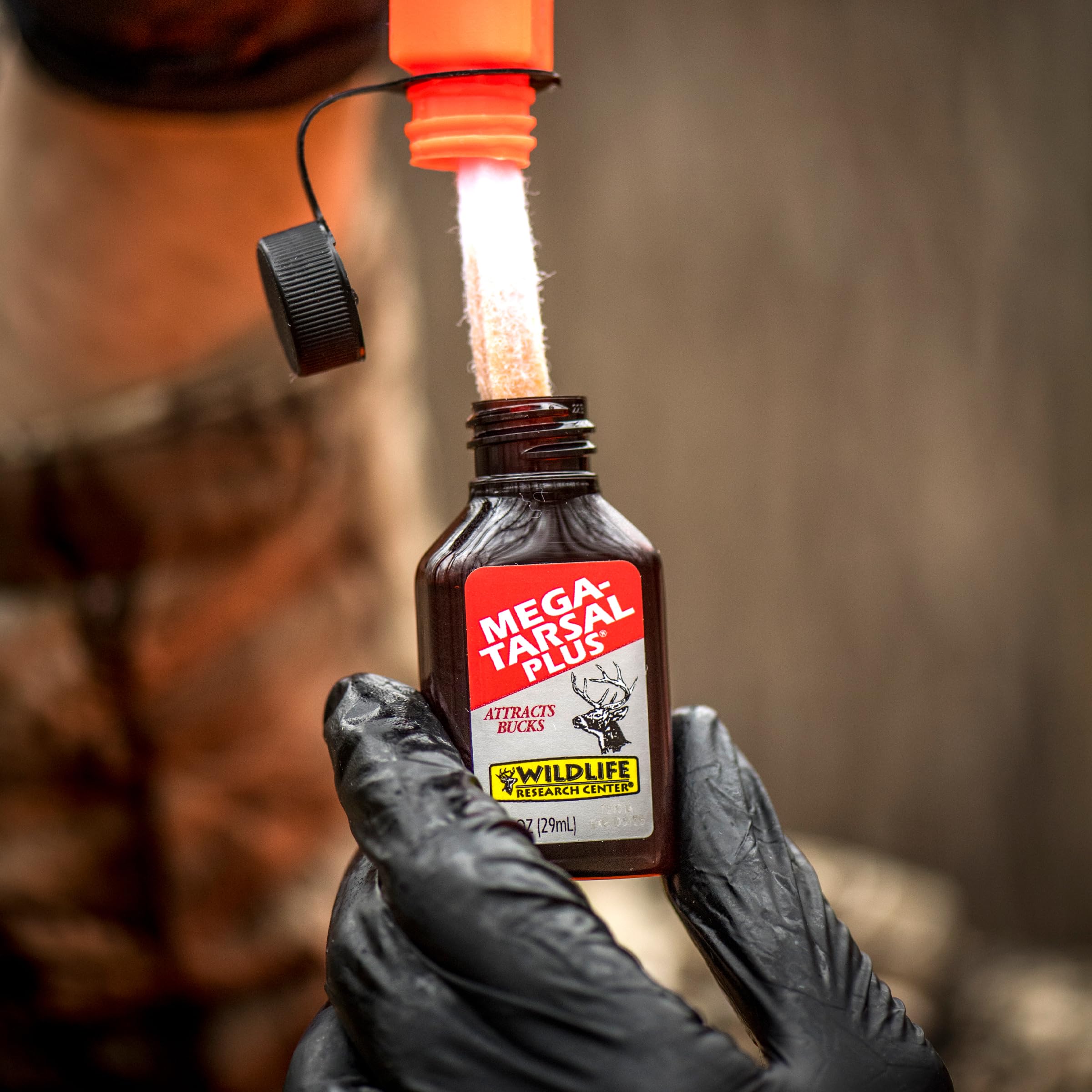 Wildlife Research Center Mega-Tarsal Plus bottle releases musk to spark buck interest