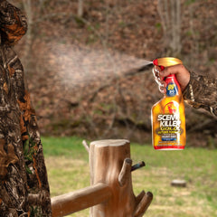 Wildlife Research Center Scent Killer Gold spray in action for odor neutralization on gear.