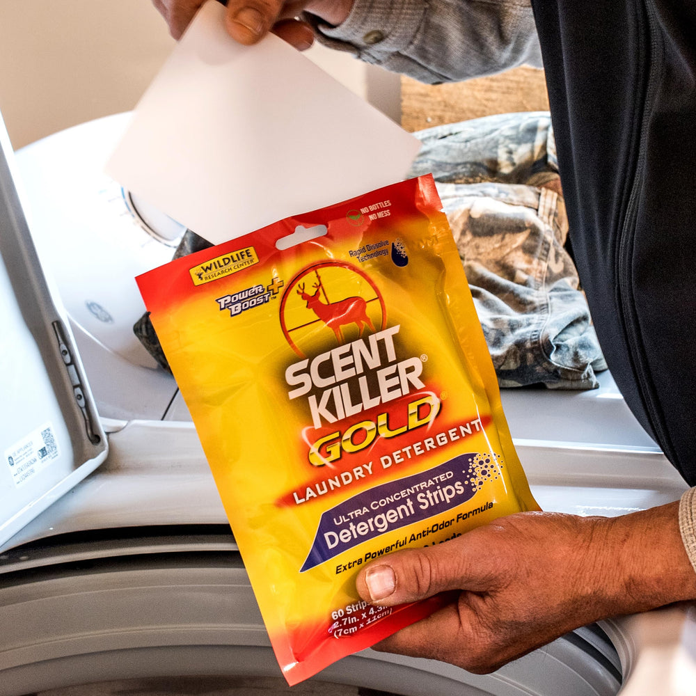 Strips dissolving in water to refresh laundry and reduce field odors.