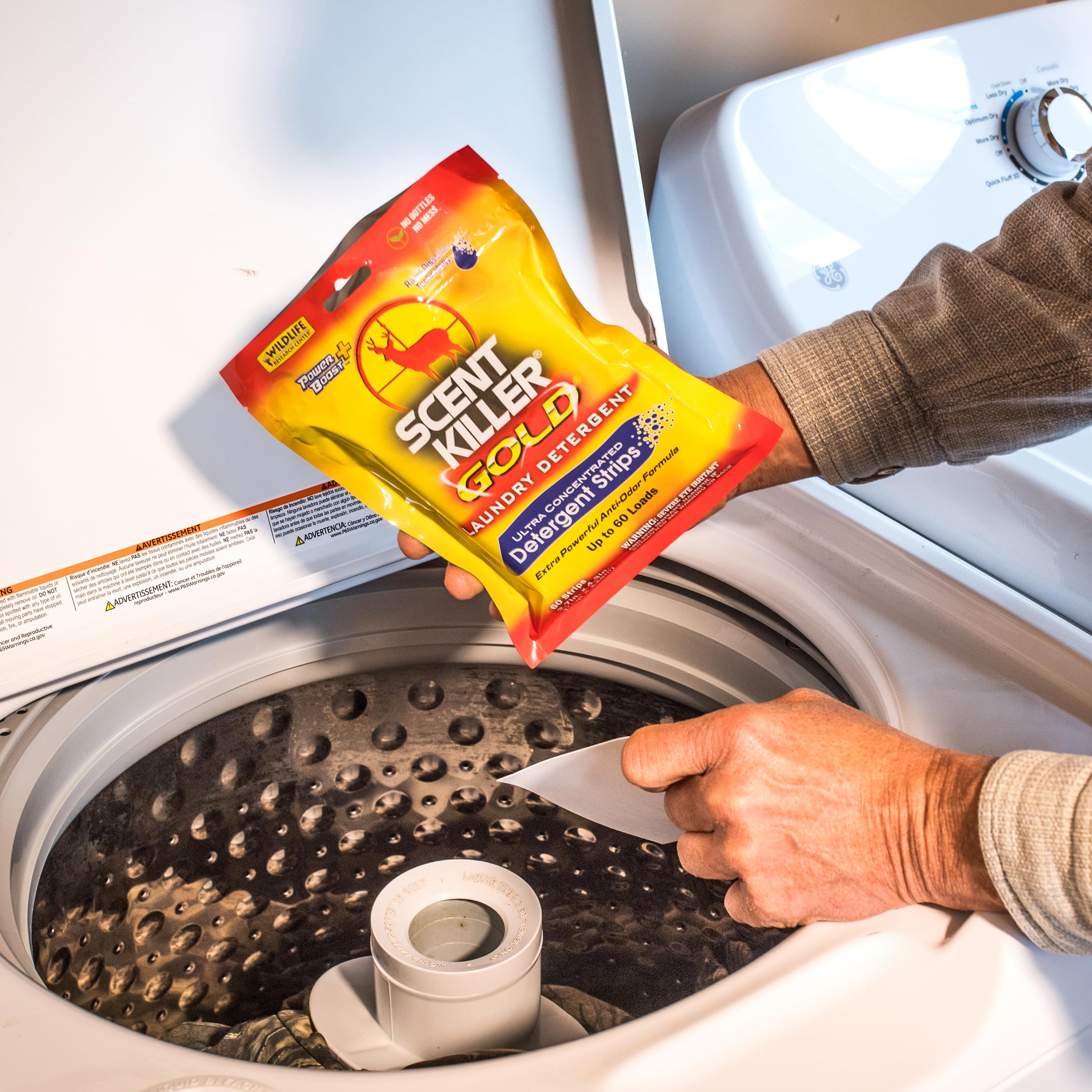Scent Killer Gold strips in rugged outdoor kit for odor control.