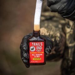 Wildlife Research Center Trails End 307 bottle cap shown for secure storage when not in use.