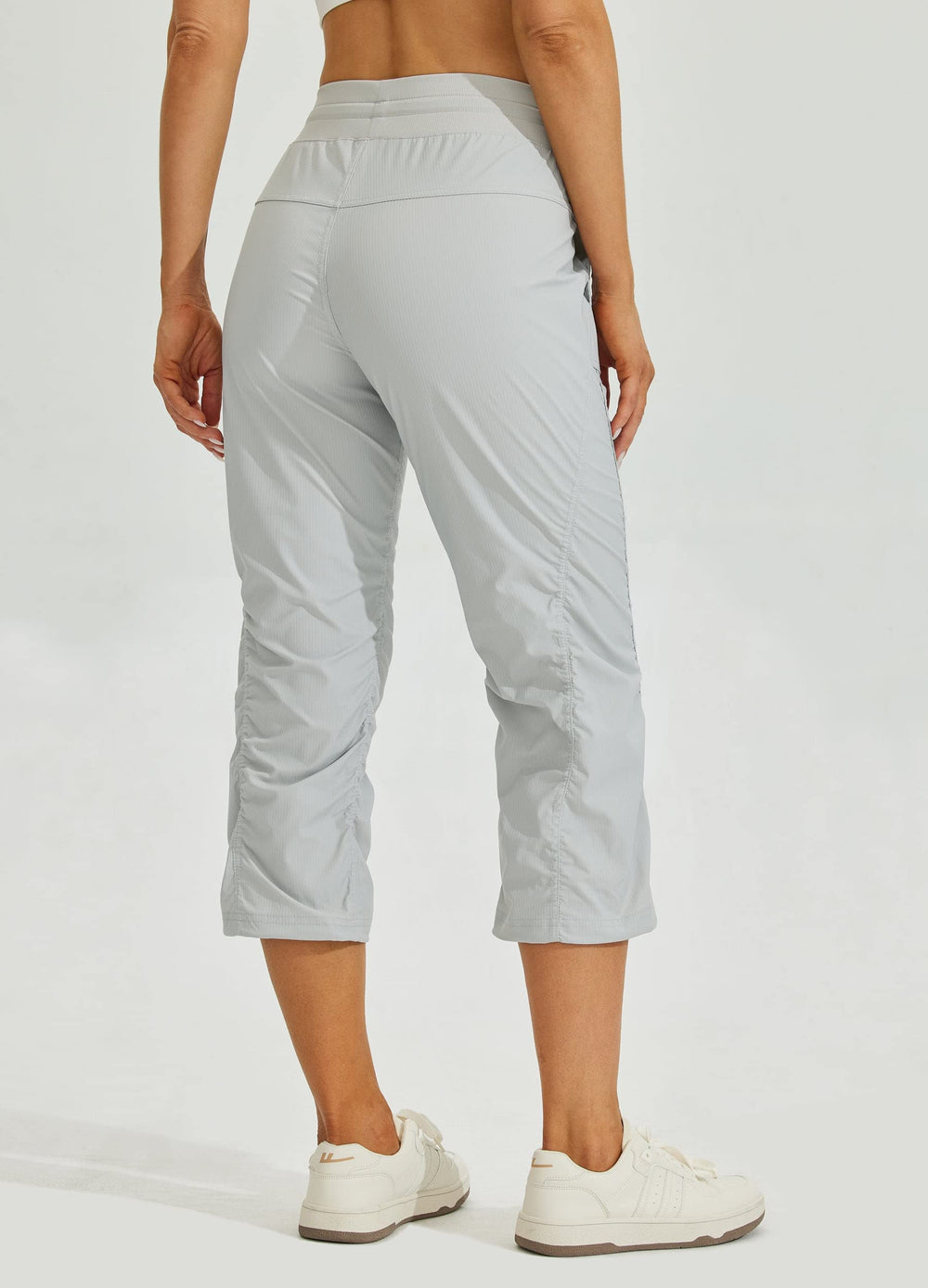 Willit capris side pocket view emphasizes practical storage for essentials during workouts