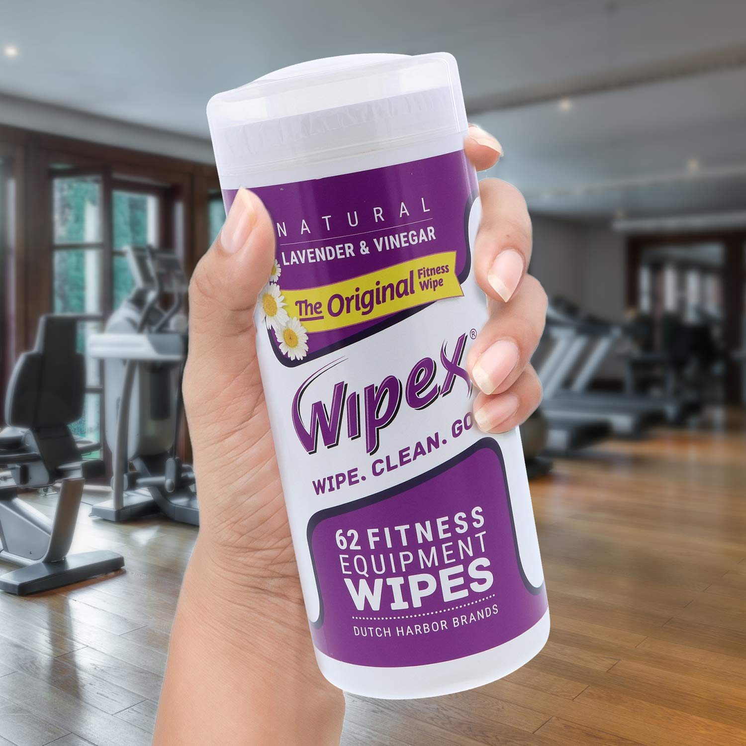 Gym equipment surface being wiped with Wipex for safe cleaning