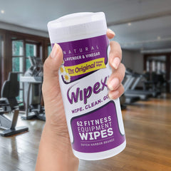 Gym equipment surface being wiped with Wipex for safe cleaning