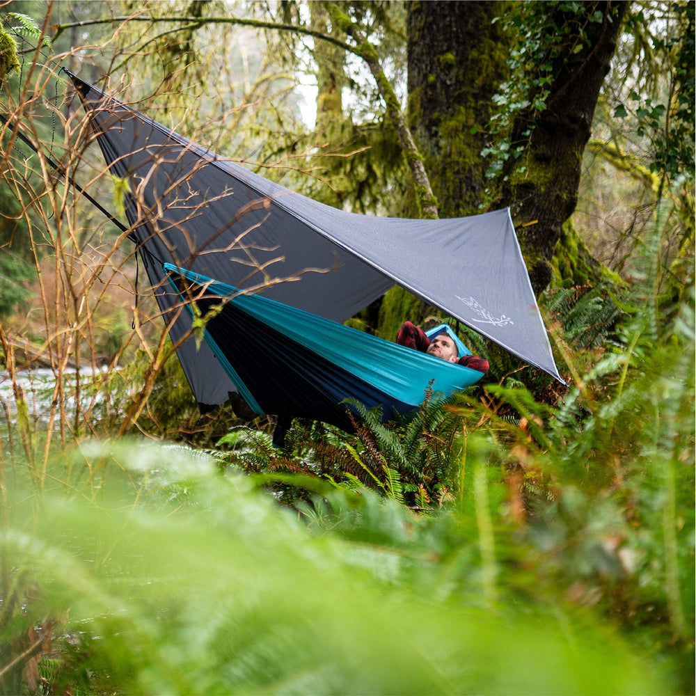 Wise Owl Outfitters adaptable-use tarp supports all-season camping