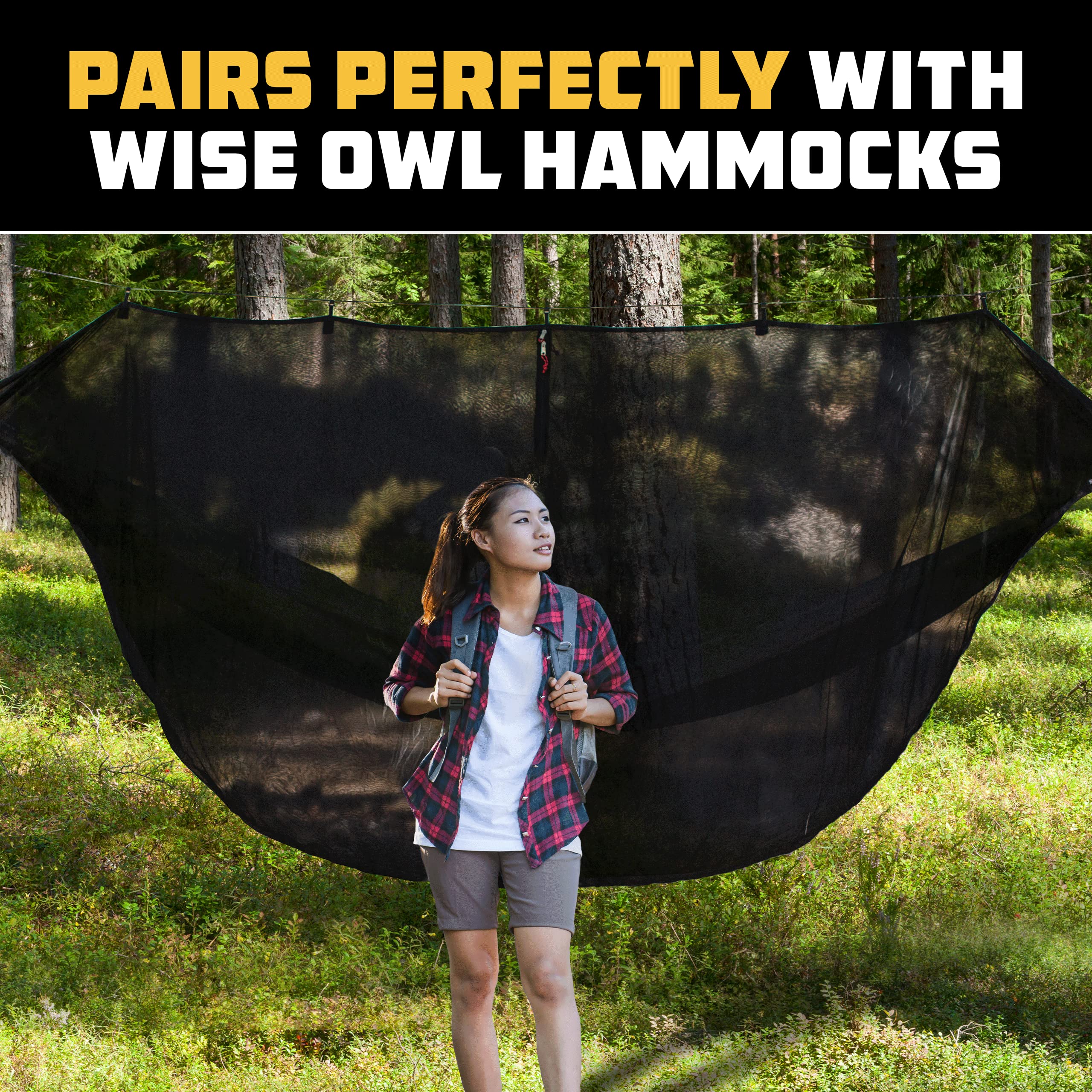 Wise Owl Outfitters hammock bug net used on a forest trail campsite.