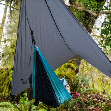 Wise Owl Outfitters multi-function shelter serves as rain fly or hammock shade on trail