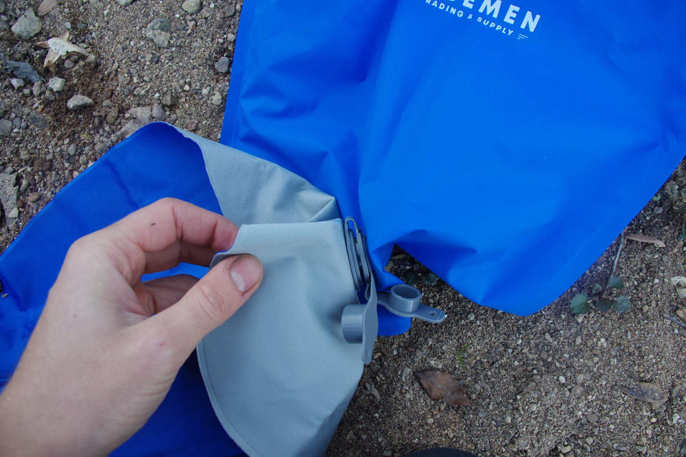 Wisemen Trading inflation bag in use during camping or outdoor trip.