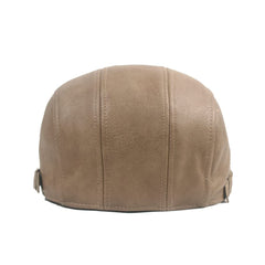 Close-up of Withmoons faux leather texture on ivy flat cap.