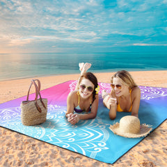 WIWIGO Beach Blanket anchor stakes demonstrating secure placement on sand