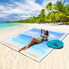 WIWIGO Beach Blanket with stakes anchored for stable ground cover.