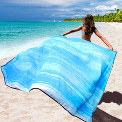 WIWIGO Beach Blanket four sand pockets and stakes secure on windy beaches.