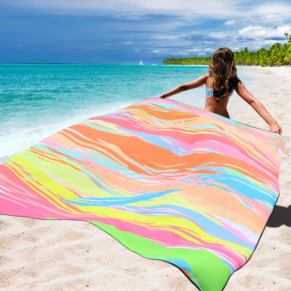 WIWIGO beach blanket uses lightweight water-repellent fabric for quick drying and cleaning.