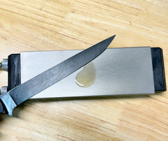 Wolf Premium Oils Honing Master cleans and conditions wet stones and metal or diamond sharpeners.