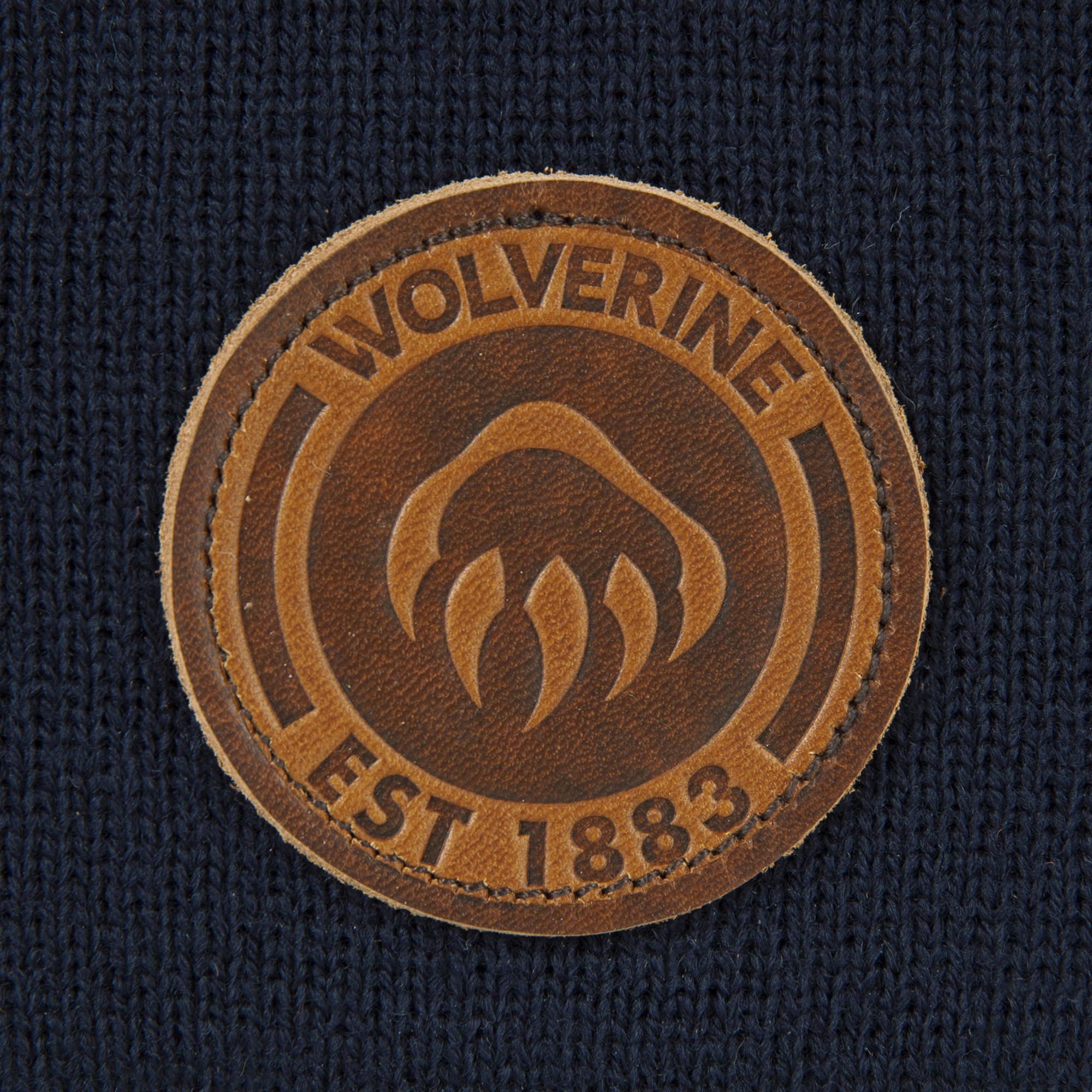 Wolverine watch cap worn outdoors during outdoor activity.