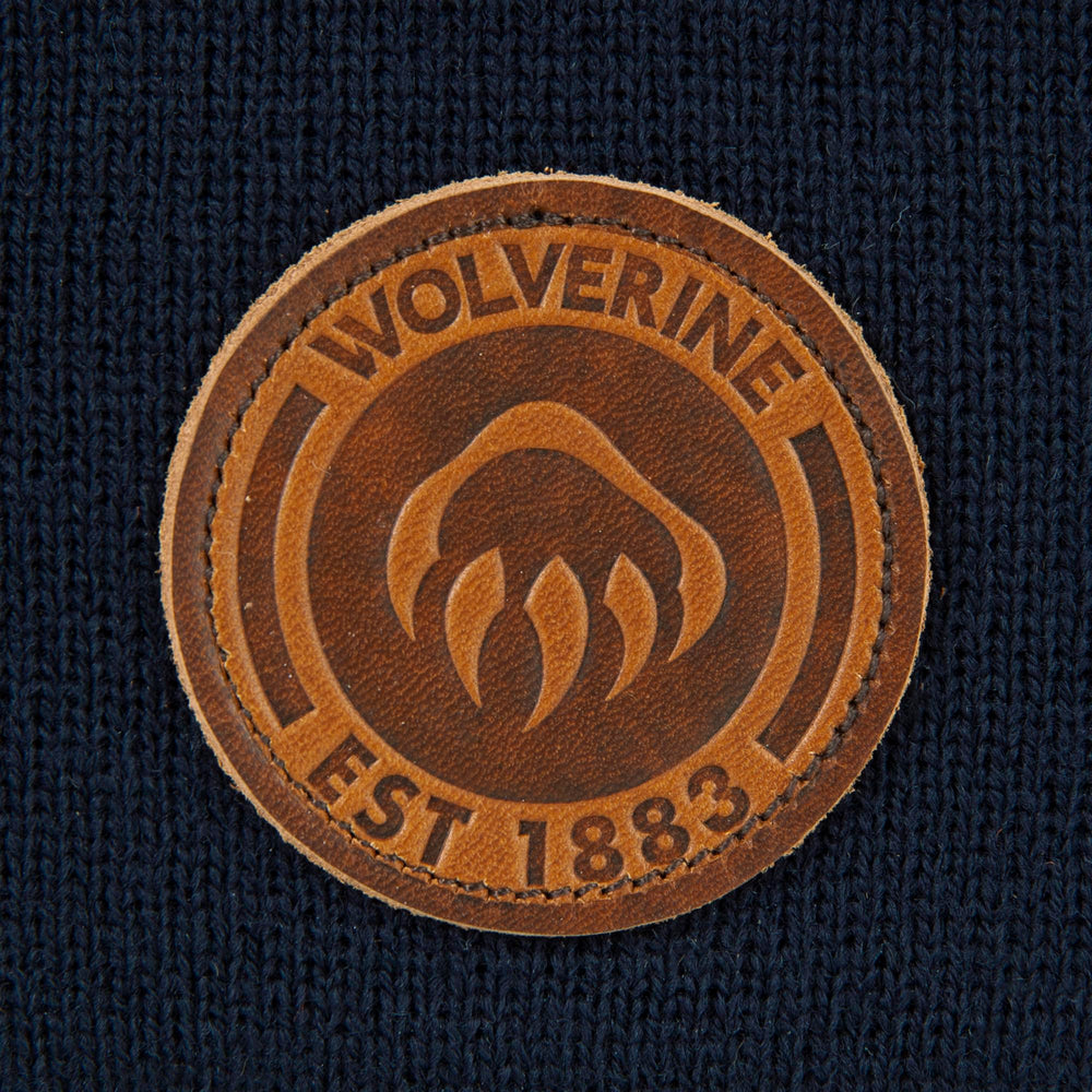 Wolverine watch cap worn outdoors during outdoor activity.