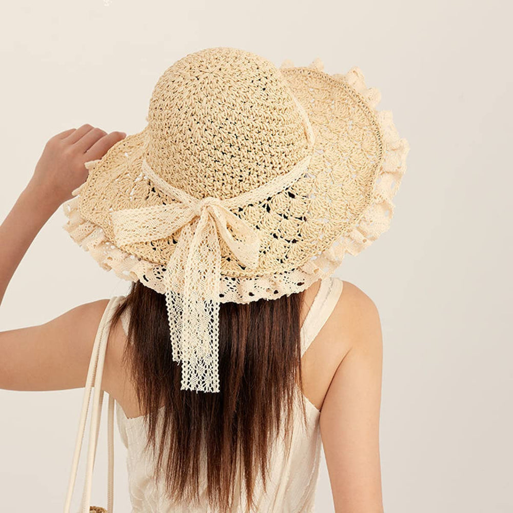 Beige straw hat with lace brim and adjustable chin strap