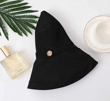 Folded, travel-friendly black sun hat