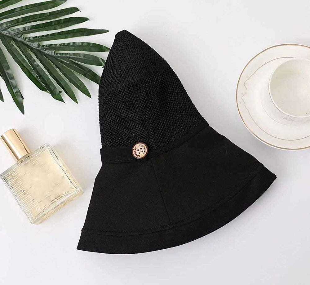 Folded, travel-friendly black sun hat