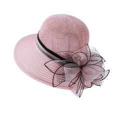 Womens party derby hat with organza pink flowers for garden parties.