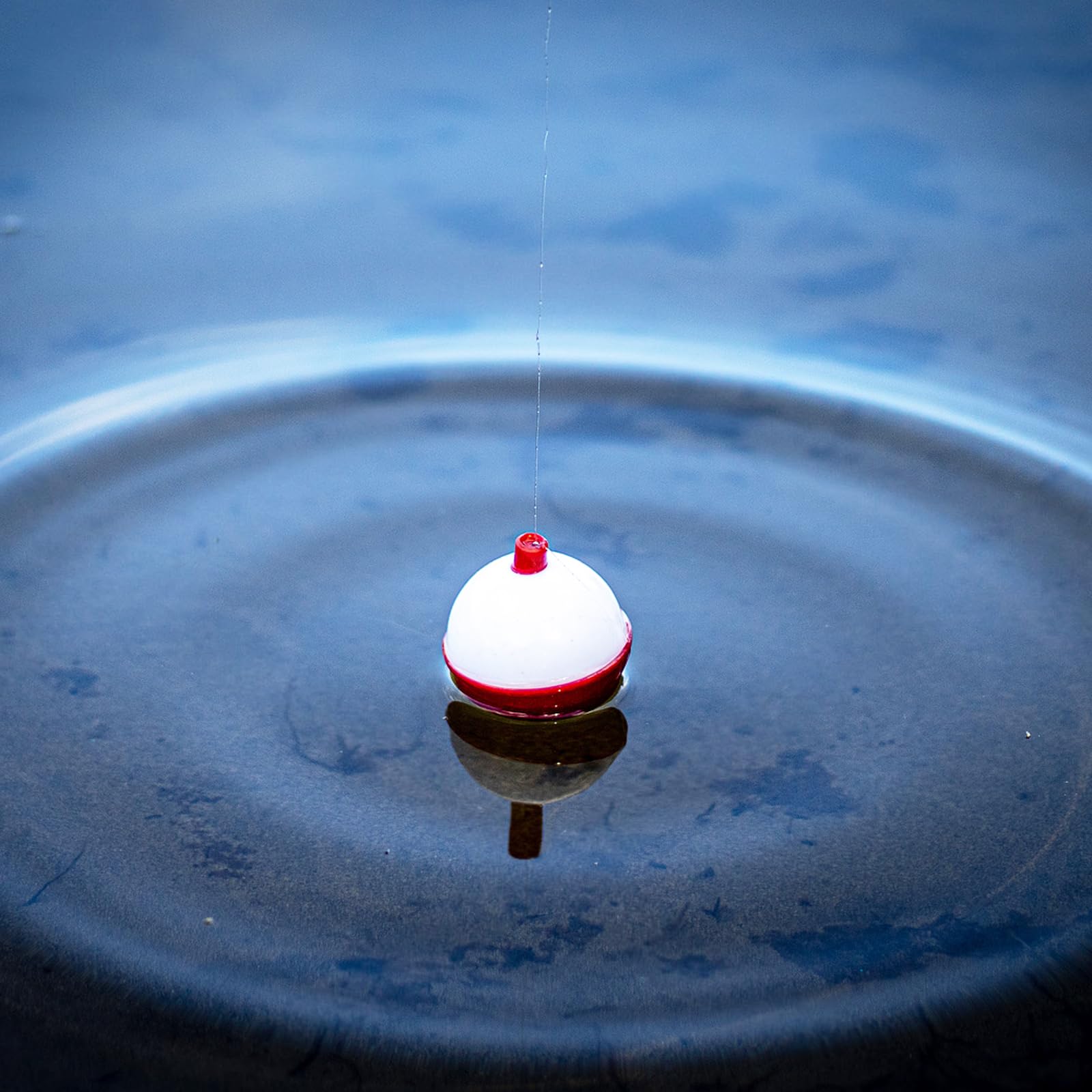 Close-up of ABS fishing float with metal hooks ends