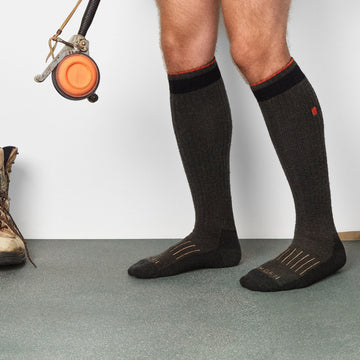 WORN merino hunting socks in-boot setup demonstrates secure under-boot wear