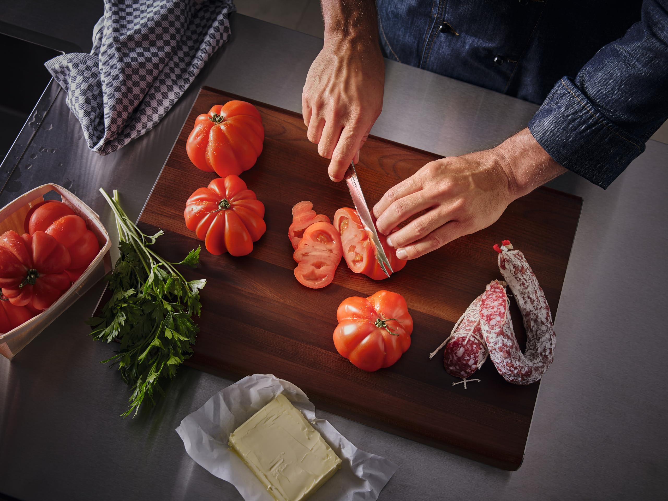 Wüsthof Classic 6-inch Utility Knife slicing vegetables cleanly.