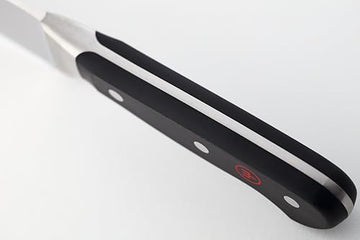 Wüsthof Classic 8-Inch bread knife handle detail showing secure full tang grip.