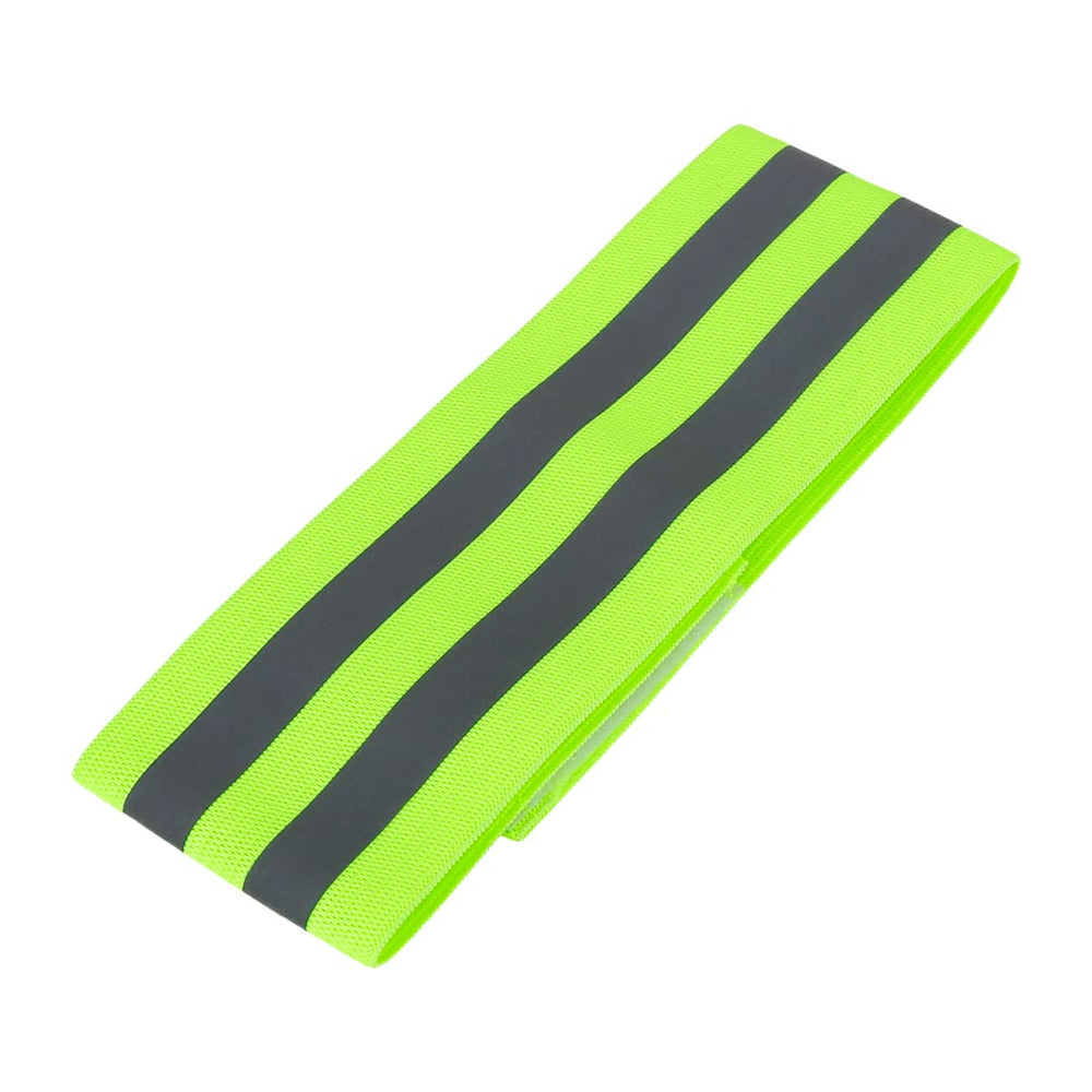 X AUTOHAUX wrist band in use during jogging in low-light conditions.
