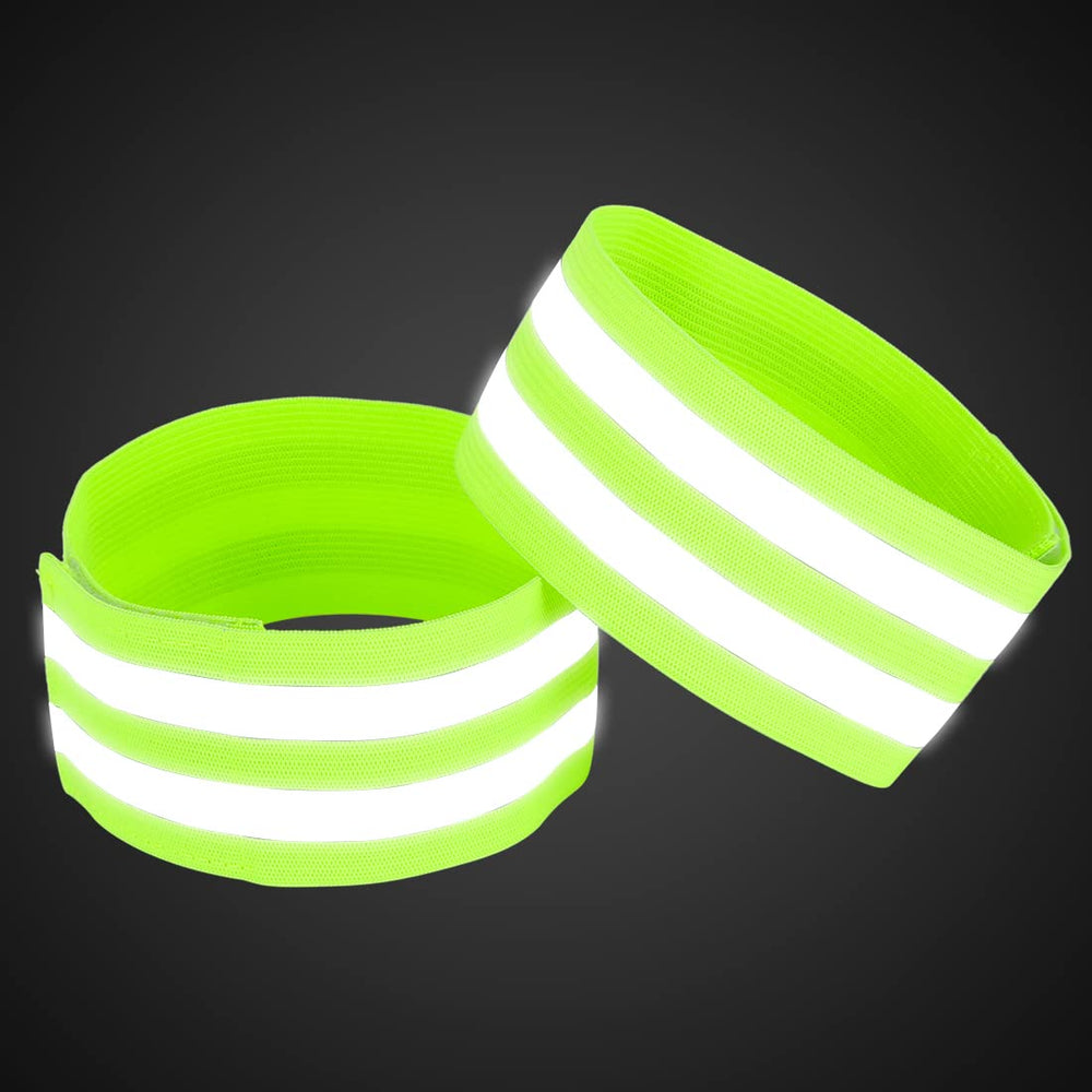 X AUTOHAUX green arm band worn on wrist for cycling visibility.