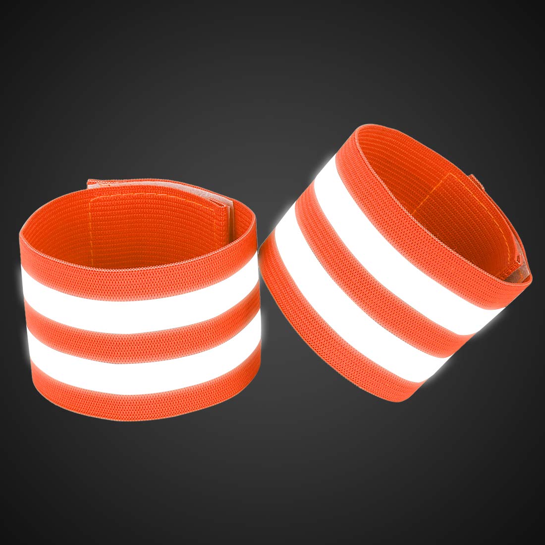 Wrist wearing orange reflective band by X AUTOHAUX during dusk cycling