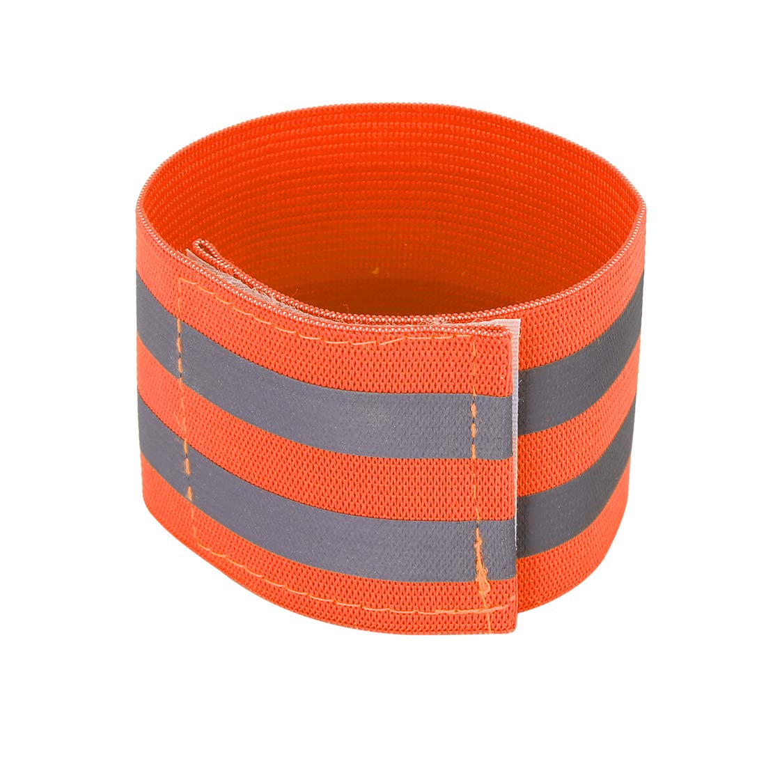Cyclist wearing X AUTOHAUX reflective wristbands on a daily ride