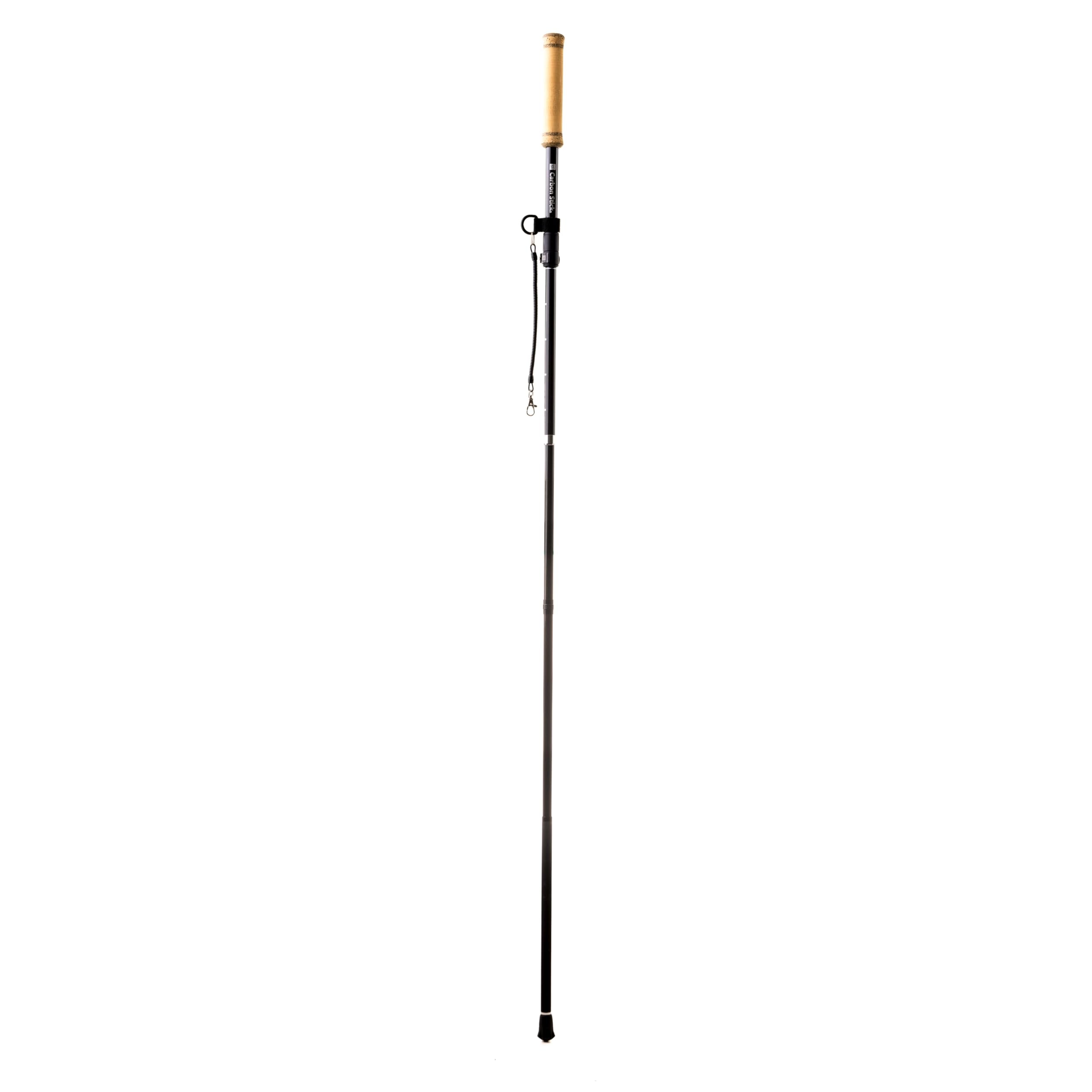 X Carbon Stick Wading Staff displayed in outdoor river environment