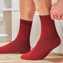 Yacht & Smith women's warm boot socks on foot, providing insulation for cold outdoor activities.